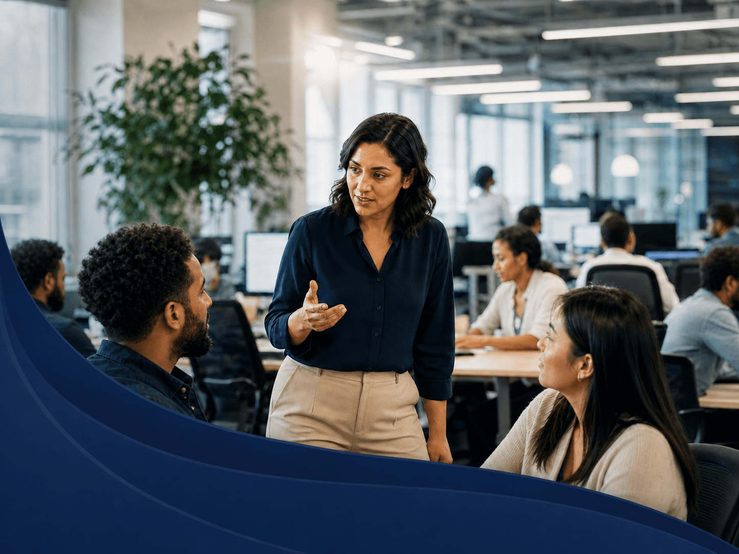 An operations leader coaching colleagues on a customer service floor